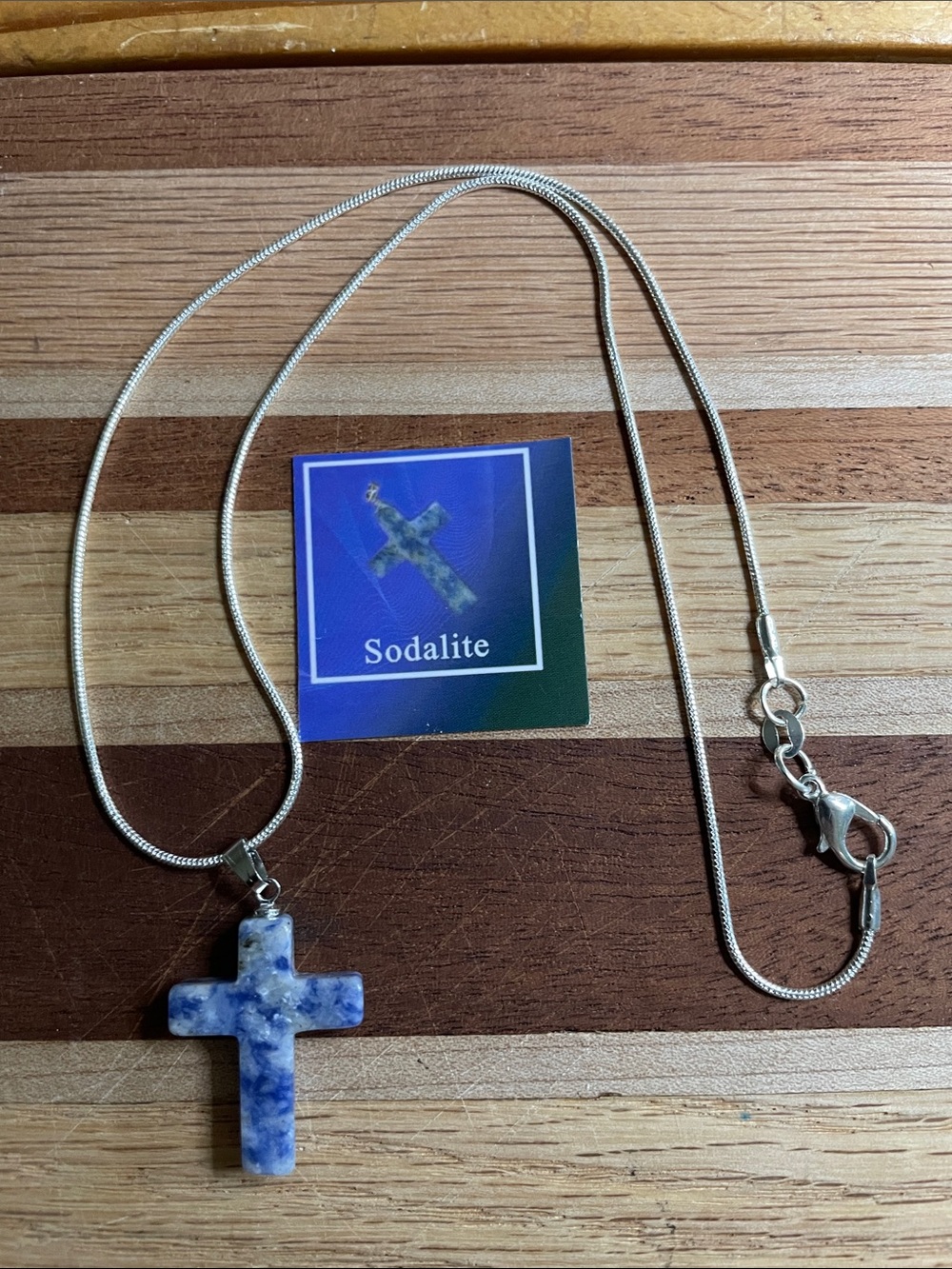 Very pretty Sodalite Natural Stone Cross new with 16” silver chain.